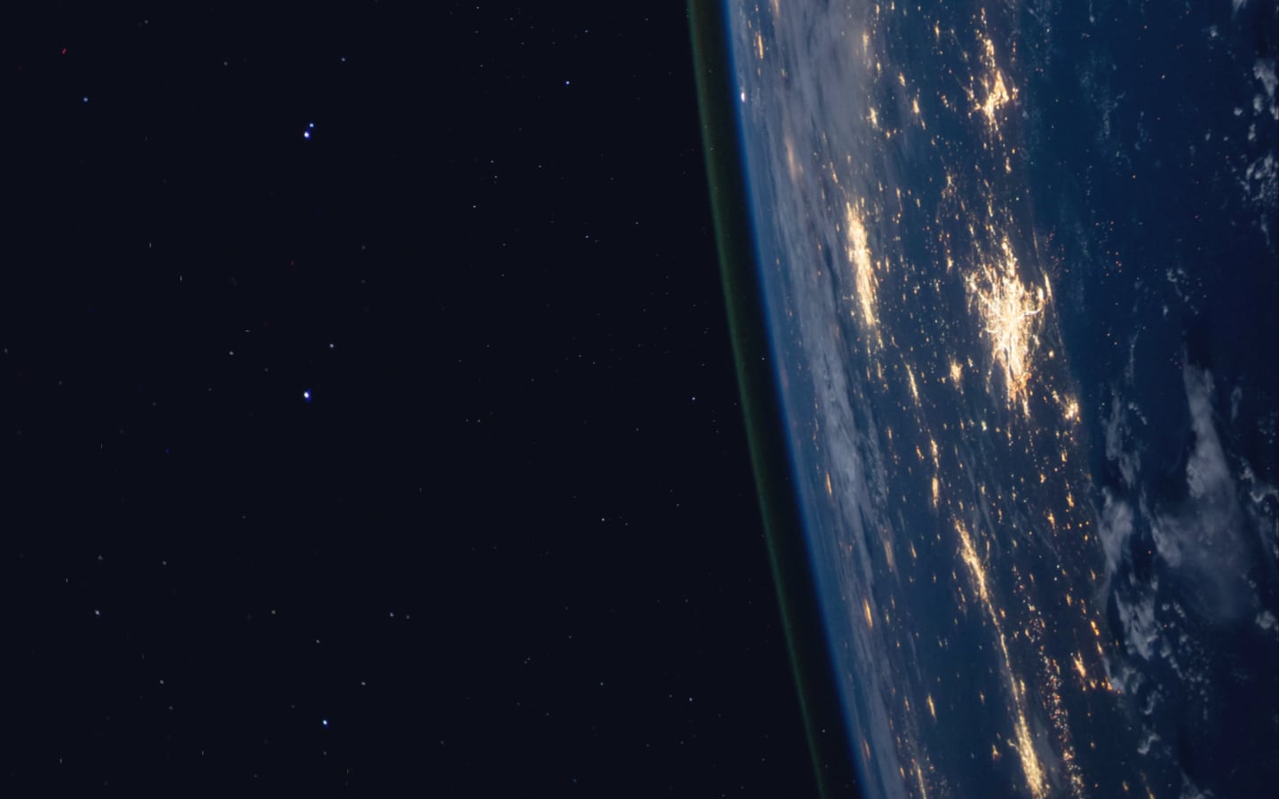 A view of Earth from space, with stars to the left.